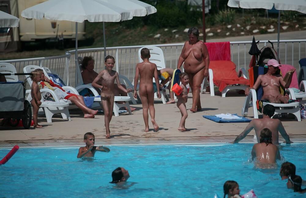 Naturist Afternoon Pool Games pics - Nudity is an expression of naturalness and sincerity