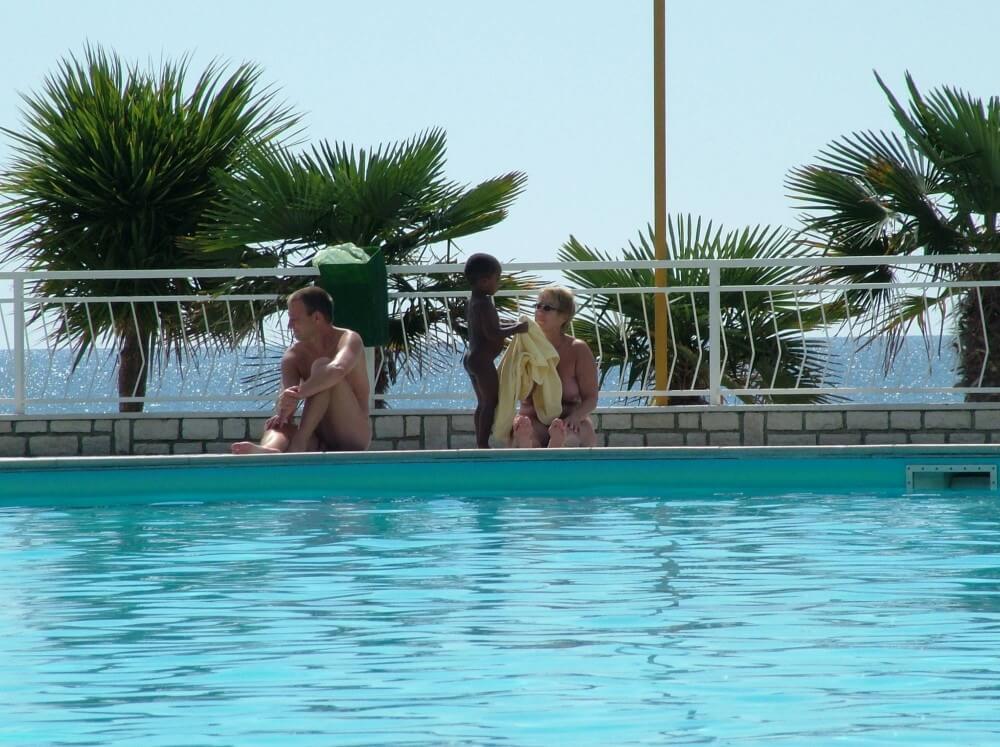 Photo of naturists in an outdoor pool - Its one thing to see nudists, but another to be a nudist yourself